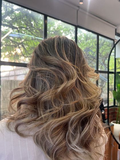 A still shot of a beautiful lived-in color, with a mix of ash and golden tones for a multi-dimensional blonde.