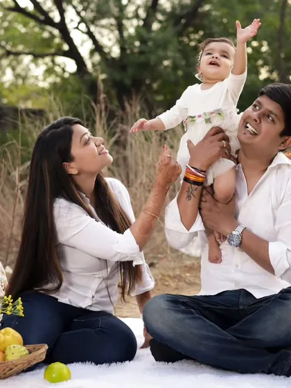 Sometimes the most beautiful moments are the simple ones. We did this outdoor pre-birthday session with a relaxed picnic theme. Capturing the pure love and happiness between parents and their beti is what makes our job so special.
