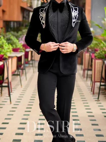 A full-length view of the black velvet tuxedo. This is the epitome of modern formalwear, designed to make you the center of attention.
