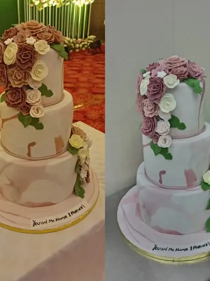 A magnificent three-tiered wedding cake with a marble effect and cascading sugar flowers in shades of mauve and white. This cake is a true statement piece for a grand reception.