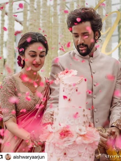 The cake cutting moment. The bride looks radiant with her soft engagement glam, which was designed to look beautiful both in person and in photos, under any lighting.