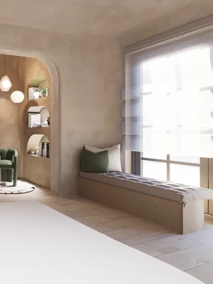 A built-in bench by the window provides a cozy spot for reading or enjoying the view. The entire room is designed with clean, minimal lines to evoke a sense of peace and relaxation.