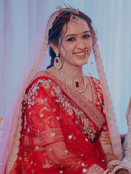 My gorgeous bride Twinkle wanted a luminous, fairytale look. We achieved this with shimmering eyelids, highlighted cheeks, a bold lip, and a dreamy floral braid.