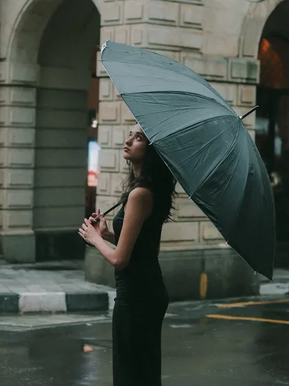 A solo portrait session in the Mumbai rain. I love using the monsoon to create a moody, cinematic feel that brings out a different kind of beauty and strength.