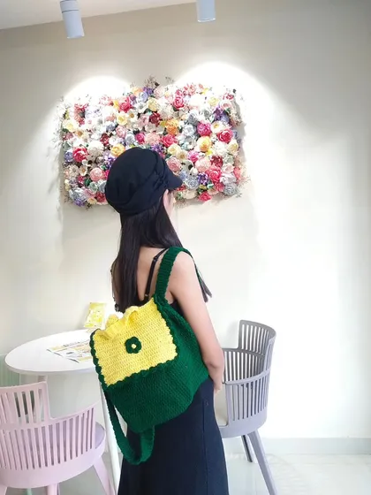 Another shot of the backpack, this time from the back, in a lovely cafe setting.