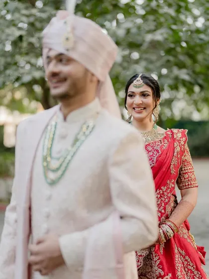 The first look. Her radiant smile as she sees her groom is what it's all about. The makeup enhances her happiness, making her glow from within.