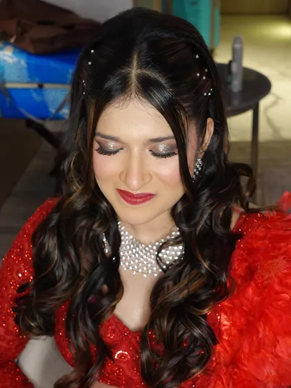 Amileen with her eyes closed, showcasing the beautiful glittery eye makeup for her Sangeet.