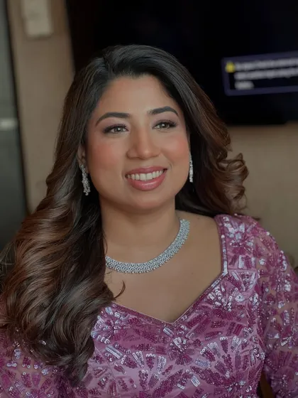 This is that 'lit-from-within' glow I adore creating. For Hiral, we focused on a glossy, glass-skin finish that looks fresh, radiant, and feels incredibly light, perfect for her party look.