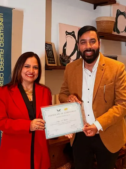 A winner proudly receives his certificate of achievement. Our ceremonies are a chance for poets to be seen and celebrated.