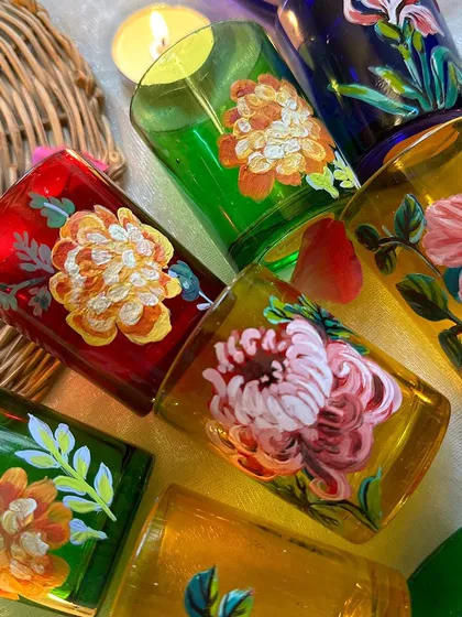 A beautiful collection of our various floral-painted candle holders.