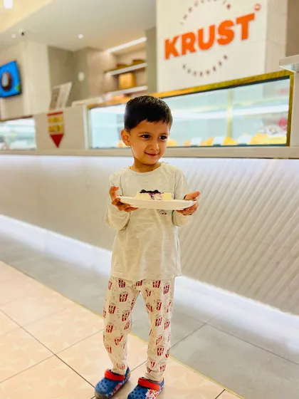 Another shot of our little fan and his cheesecake. I strive to create treats that bring smiles to faces of all ages.