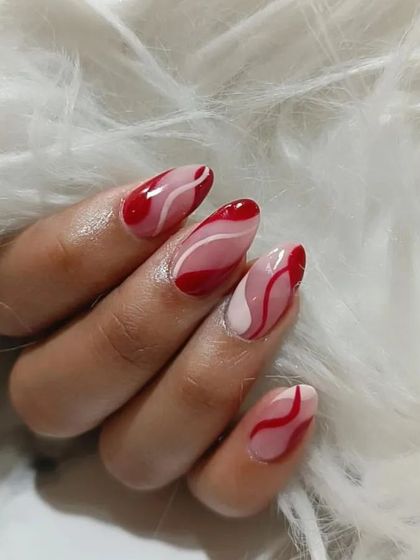 A bold abstract design with red and pink wavy lines on a sheer base, creating a modern and artistic look.