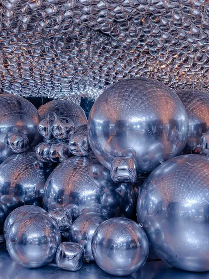 A futuristic and immersive photo-op I designed, featuring a cave of silver spheres that created incredible reflections and a sense of wonder.