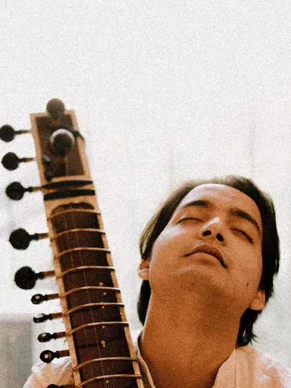 A moment of pure bliss, lost in the sound of the sitar. This is what it feels like when the music flows effortlessly.