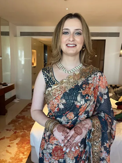 A happy client portrait. My goal is to make everyone, including international guests, feel their absolute best at Indian weddings.
