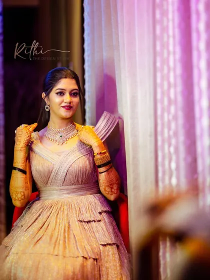 Our bride looking serene and beautiful in her rose gold gown before her cocktail party.