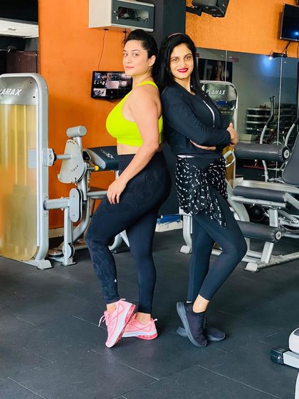 Back to back with my client, ready to tackle the workout ahead. We are a team.