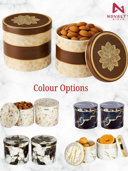I offer a wide variety of individual dry fruit containers to choose from. This image shows several options, from traditional floral patterns to modern marble designs, perfect for customizing your hamper.