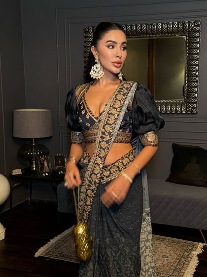 A stunning look for a JJ Valaya campaign, featuring a modern half-up ponytail with puffed sleeves.