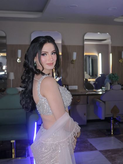 My beautiful engagement bride ready to celebrate. Her silver lehenga was the inspiration for this shimmery, glamorous makeup look with bold, beautiful curls.