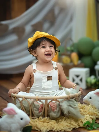 A happy little farmer in our mango-themed setup. The bright yellow hat and huge smile perfectly capture the fun and flavor of this unique session.
