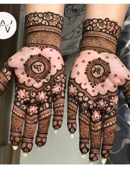 A sweet and personalized design for a mom-to-be, with "Maa" and "Paa" (Mom and Dad) written in the center of lotus mandalas.