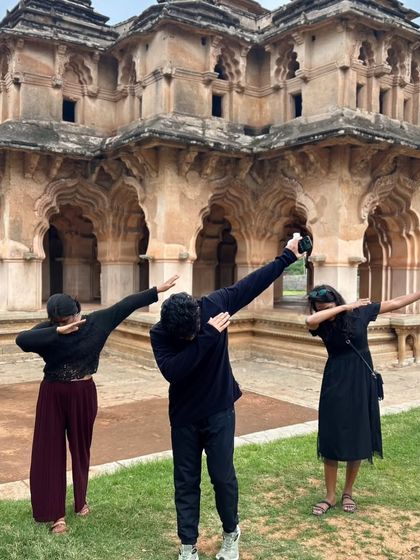 A fun dab pose in front of the Lotus Mahal in Hampi. We bring a youthful energy to our heritage explorations.