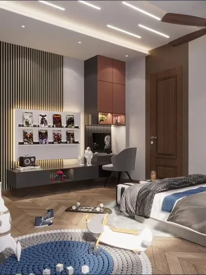 A bedroom is not just for sleeping; it's a space that reflects character. This kids' bedroom is designed for play and creativity, featuring a neon astronaut light, a rocket-themed rug, and a dedicated area for displaying collectibles and doing homework.