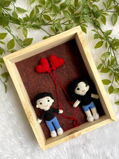 "Love in a Frame" featuring a mini couple replica holding heart-shaped balloons. This is a perfect and unique gift for anniversaries, weddings, or Valentine's Day.