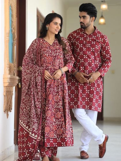 A lovely maroon set with a delicate floral pattern. These coordinated outfits are perfect for creating lasting memories during pre-wedding photoshoots or family functions.