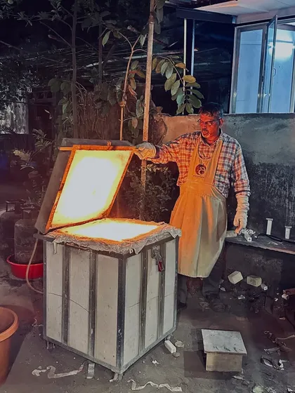 This is the moment of transformation. I am opening the kiln during a Raku firing session, where intense heat and sudden cooling create beautifully unpredictable patterns. It's a process that's as much about letting go as it is about control.