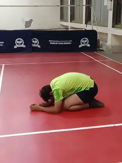 The child's pose is a restorative posture that gently stretches the back and hips. It's a great way to cool down and refocus after a tough drill.