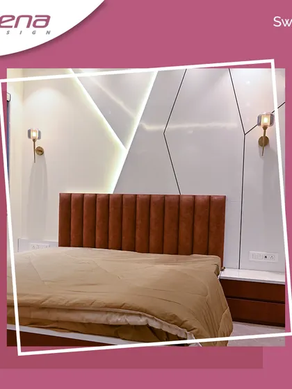 This bedroom features a striking accent wall with geometric white panels and a brown leather-finish headboard. The wall-mounted bedside tables and warm wall sconces add to the clean, contemporary feel.