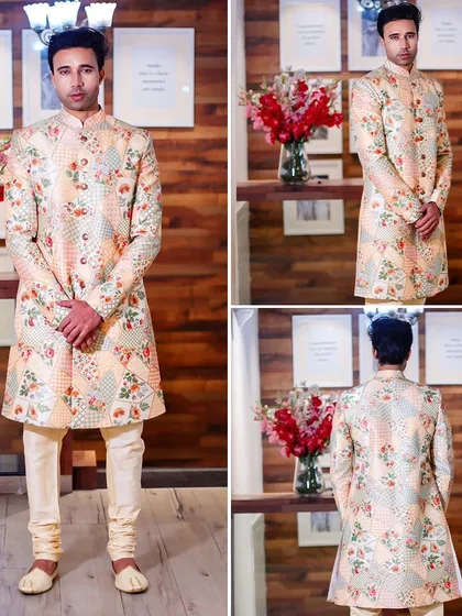 A beautiful pastel sherwani featuring a patchwork of floral and geometric prints. This is a modern, artistic take on traditional wedding wear.