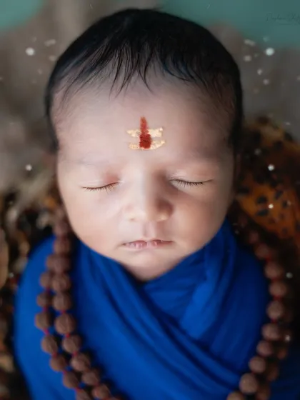 A close up of the baby's forehead adorned with a Tripundra, a sacred symbol. It's these thoughtful details that make festive shoots so special.