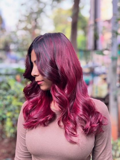 Got red hair and wings. This vibrant, fiery red is for the bold and fearless, styled in beautiful waves to show off its intensity.