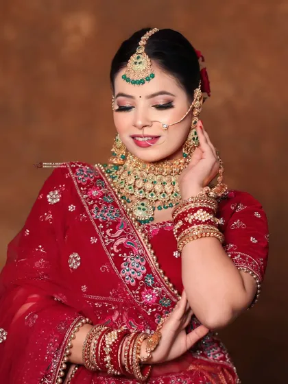 A candid moment that captures the bride's serene beauty. The makeup is set to be flawless through all the emotions of the day.