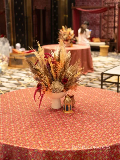 A beautiful centerpiece for a rustic-themed event. I used dried florals and pampas grass in an earthy color palette to create a textured and sophisticated arrangement for the guest tables.