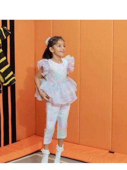 This Rainbow Co-ord set is perfect for a fun day out. The shorts make it practical for an active child, while the ruffled top keeps it looking special.