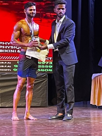 Kumar Kapil receiving his well-deserved silver medal in the men's physique division at the Mr. India competition. His dedication during prep was unmatched.