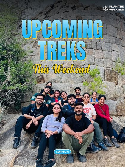A group of friends relaxing on the ruins of a fort during a weekend trek. Explore our upcoming trips for a mix of history and nature.