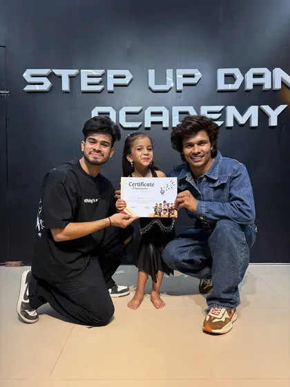 Anushka, a young dancing star, with her certificate.