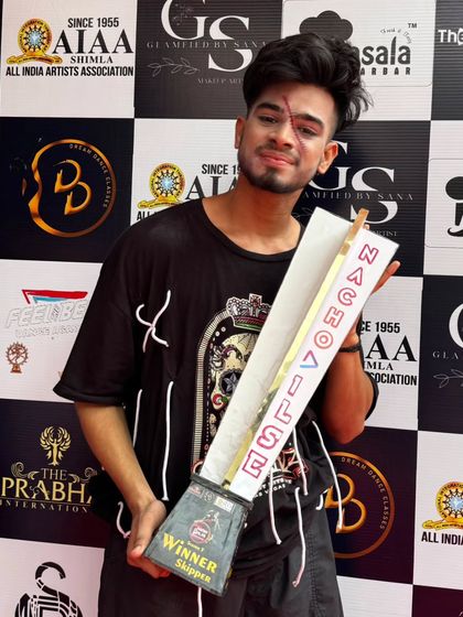 Holding the trophy with a scar on my face from the finale performance makeup. We literally put our blood and sweat into our art.