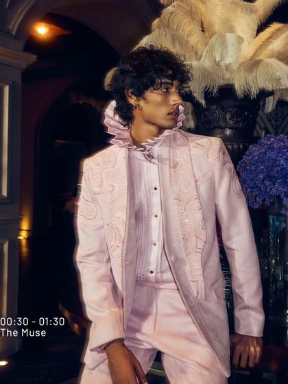 The Muse is where inspiration lingers. This blush pink suit, with its ruffled collar and subtle embroidery, is for the man who crafts his own narrative. The journey is just beginning.