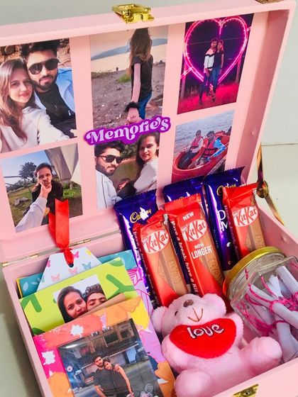 Another look at my pink birthday trunk hamper, loaded with chocolates, a teddy bear, and a jar of love notes. The photo collage inside makes it a truly personal gift.