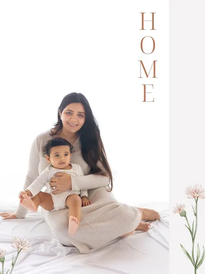 A simple portrait of a mother and child on a white background with the word "HOME". Sometimes the most minimal setups create the most powerful images.