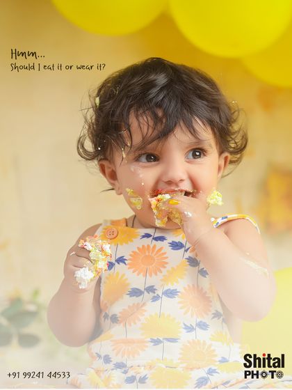 "Should I eat it or wear it?" This close-up perfectly captures the hilarious dilemma every baby faces during their first cake smash.