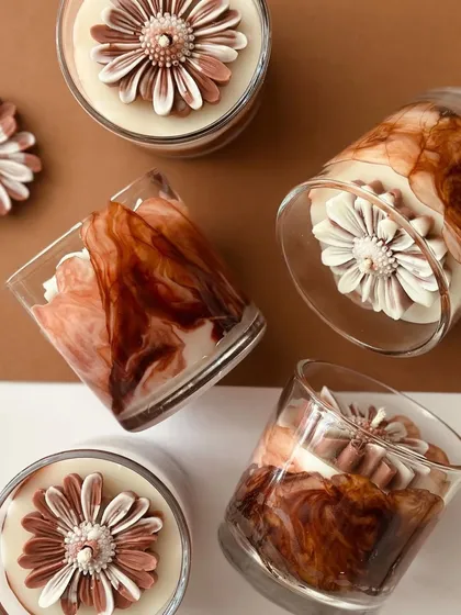 Experimenting with new styles in our monochromatic collection. This candle features a stunning coffee gradient design, topped with our signature daisy. A must-have for coffee and candle lovers.