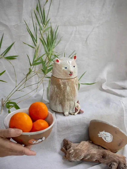 A whimsical, animal-themed collection from a professional course student, featuring a bear-shaped lidded jar and illustrated bowls.