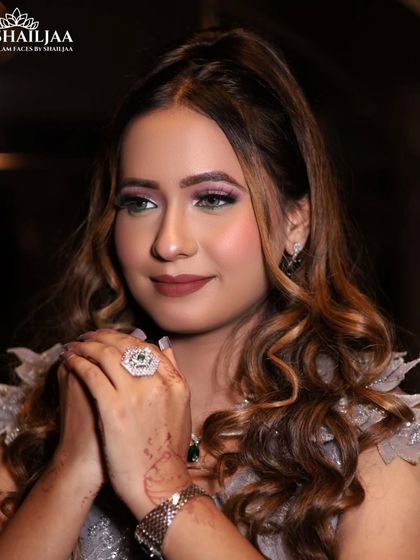 A close-up of this engagement look, featuring soft, shimmery eyeshadow and perfectly curled hair. The makeup is designed to be elegant and timeless.